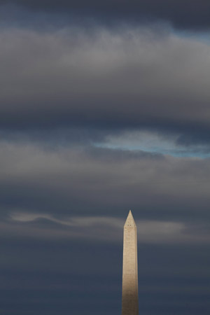 Sun breaks through on the Washington Monument.