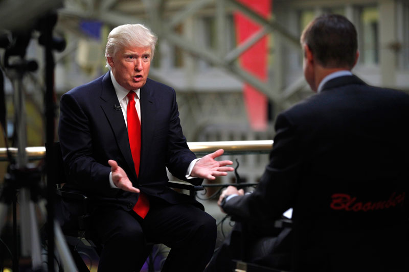 Real estate developer Donald Trump speaks during a television interview following a news conference at the Old Post Office Pavilion in Washington, D.C., U.S., on Tuesday, Sept. 10, 2013. Trump announced the signing of an agreement with the U.S. government to turn the historic building into a $200 million luxury hotel, according to the Washington Post. Photographer: Julia Schmalz/Bloomberg